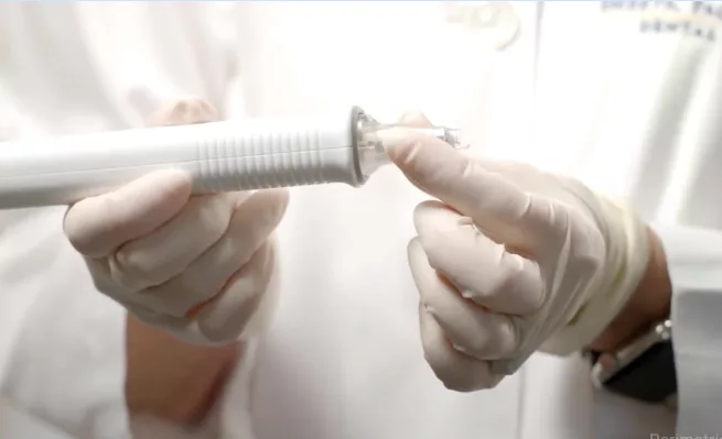 Clinician holding the InnerView handpiece, showcasing its ease of use and ergonomic design for seamless diagnostics in practice.
